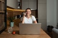 Young smiling woman or girl talking on the phone with internet provider customer service working on finding solution connection Royalty Free Stock Photo