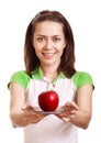 Young smiling woman give red apple on plate
