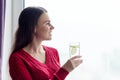 Young smiling woman with glass of water with lime Royalty Free Stock Photo