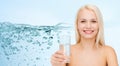 Young smiling woman with glass of water Royalty Free Stock Photo