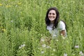 Young smiling woman in green meadow Royalty Free Stock Photo