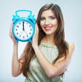 Young smiling woman hold watch. Beautiful smiling girl portrait Royalty Free Stock Photo