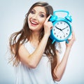 Young smiling woman hold watch. Beautiful smiling girl portrait Royalty Free Stock Photo