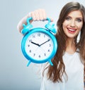 Young smiling woman hold watch. Beautiful smiling girl portrait Royalty Free Stock Photo