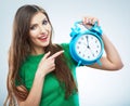 Young smiling woman hold watch. Beautiful smiling girl portrait Royalty Free Stock Photo