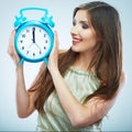 Young smiling woman hold watch. Beautiful smiling girl portrait Royalty Free Stock Photo