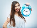Young smiling woman hold watch. Beautiful smiling girl portrait Royalty Free Stock Photo