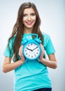 Young smiling woman hold watch. Beautiful smiling girl portrait Royalty Free Stock Photo