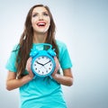 Young smiling woman hold watch. Beautiful smiling girl portrait Royalty Free Stock Photo