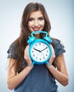 Young smiling woman hold watch. Beautiful smiling girl portrait Royalty Free Stock Photo