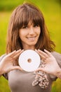 Young smiling woman holding compact Royalty Free Stock Photo