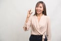 Young smiling woman holding small model house over white background studio Royalty Free Stock Photo