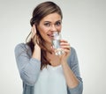 Young smiling woman holding water glass. Isolated studio portrait Royalty Free Stock Photo