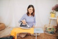 Young Smiling Woman Ironing Clothes On Ironing Board Royalty Free Stock Photo