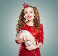 Young smiling woman and little pig, fashion portrait Royalty Free Stock Photo