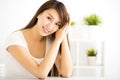 Young smiling woman in living room