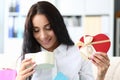 Young smiling woman opens gift box closeup Royalty Free Stock Photo