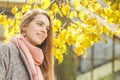 Young smiling woman outdoors. Romantic girl in autumn fall park Royalty Free Stock Photo