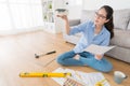 Young smiling woman planning renew house interior Royalty Free Stock Photo