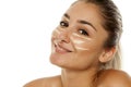 Concealer under her eyes Royalty Free Stock Photo