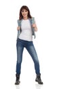 Young Smiling Woman Is Posing In Jeans Vest