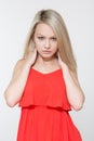 Young smiling woman in red dress. Isolated over white background. Royalty Free Stock Photo