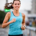 Young woman running on bridge in early morning Royalty Free Stock Photo