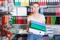 Young smiling woman standing with folders Royalty Free Stock Photo