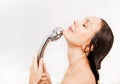 Young smiling woman taking a shower Royalty Free Stock Photo