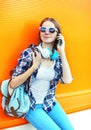 Young smiling woman talking on smartphone over colorful Royalty Free Stock Photo