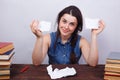 Young smiling woman tearing a sheet of paper, firing, dismissal