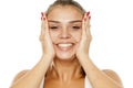 Woman tightening her face Royalty Free Stock Photo