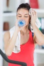 young smiling woman with towel and water after training Royalty Free Stock Photo