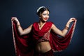 Young smiling woman in traditional indian clothing dancing Royalty Free Stock Photo