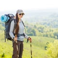 Young smiling woman traveling with backpack Royalty Free Stock Photo