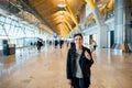 Young smiling woman traveling with carry on backpack hand luggage.Travel to destination with low cost avio company Royalty Free Stock Photo