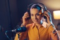 Young woman working at the radio broadcasting station