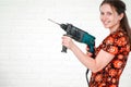 Young smiling woman posing with hammer