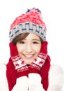 Young smiling woman in winter clothes and touching face Royalty Free Stock Photo