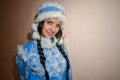 Young Snow Maiden. Sexy woman dressed in the traditional Russian New Year`s costume Snow Maiden, a girl in a blue New Year`s sui Royalty Free Stock Photo