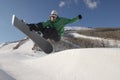 Young Snowboarder Performing Stunts On Snowy Hill