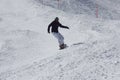 Young snowboarder woman sliding downhill. Royalty Free Stock Photo