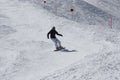 Young snowboarder woman sliding downhill. Royalty Free Stock Photo