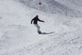 Young snowboarder woman sliding downhill. Royalty Free Stock Photo