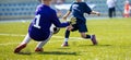 Young soccer goalkeeper save. Boy catching soccer ball