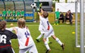 Young soccer goalkeeper save. Boy jumping and catching soccer ball