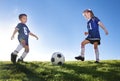 Young Soccer Players Kicking Ball Royalty Free Stock Photo