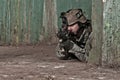 Young soldier behind obstacle