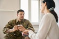 Young soldier communicates with a woman psychologist Royalty Free Stock Photo