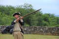 Young soldier dressed in period clothes, demonstrating musket firing,Fort Ticonderoga,New York,2014